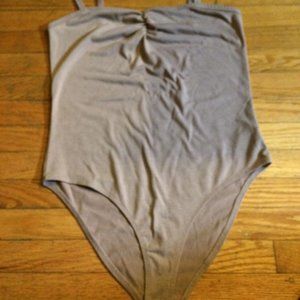 brownish beige bodysuit in a medium US never worn brand new